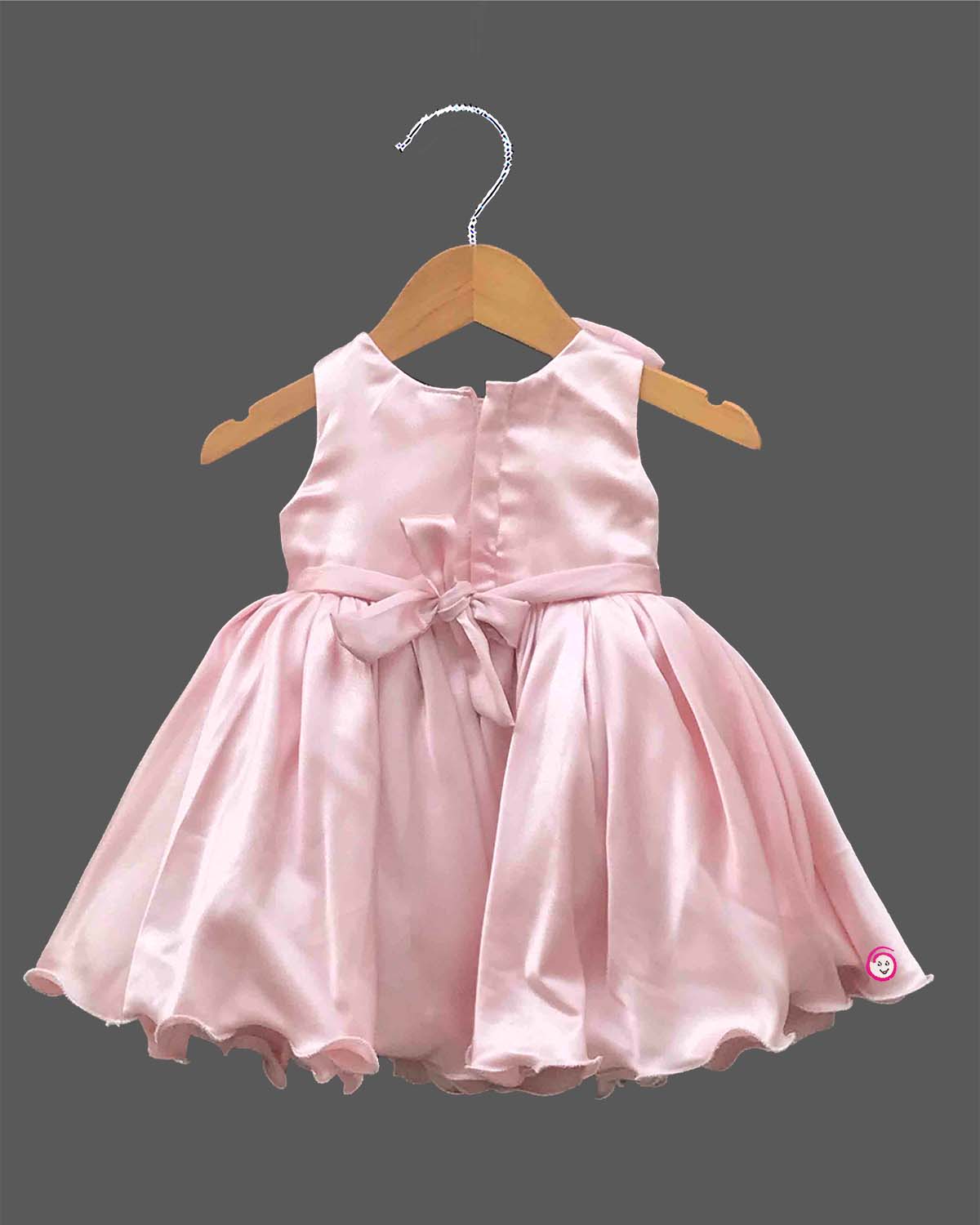 Baby girl satin party frock with bow accent and crystal embellishment for birthday celebration