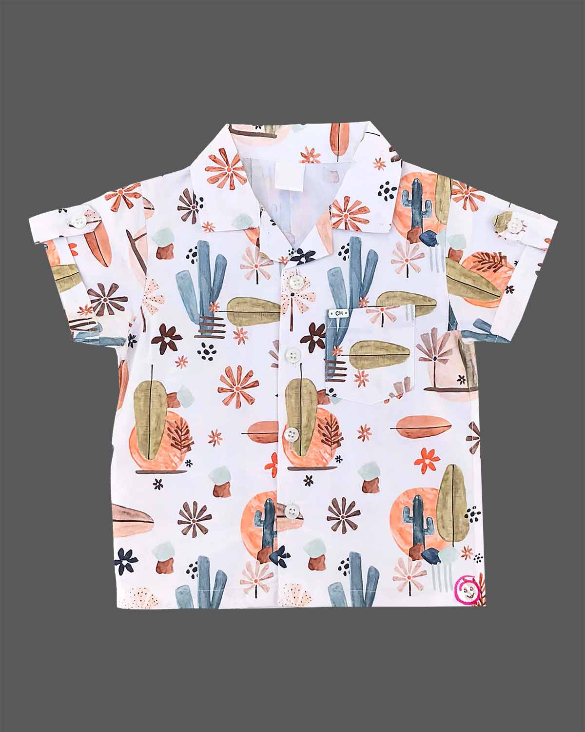 Boys 2-piece cotton casual co-ord set featuring a short-sleeve collared shirt and matching shorts in white with cactus, palm leaves, and desert botanical prints