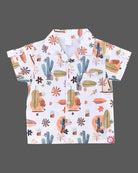 Boys 2-piece cotton casual co-ord set featuring a short-sleeve collared shirt and matching shorts in white with cactus, palm leaves, and desert botanical prints