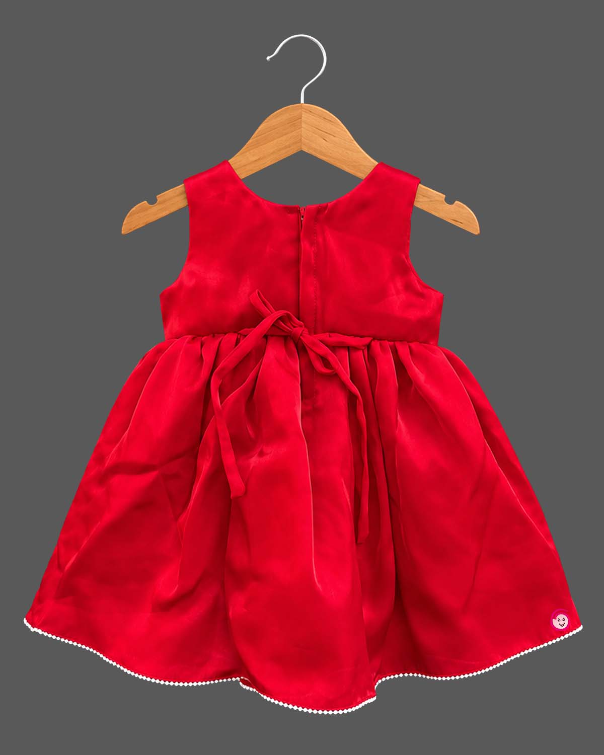 Sleeveless satin party frock with waist accents and kids party wear details.