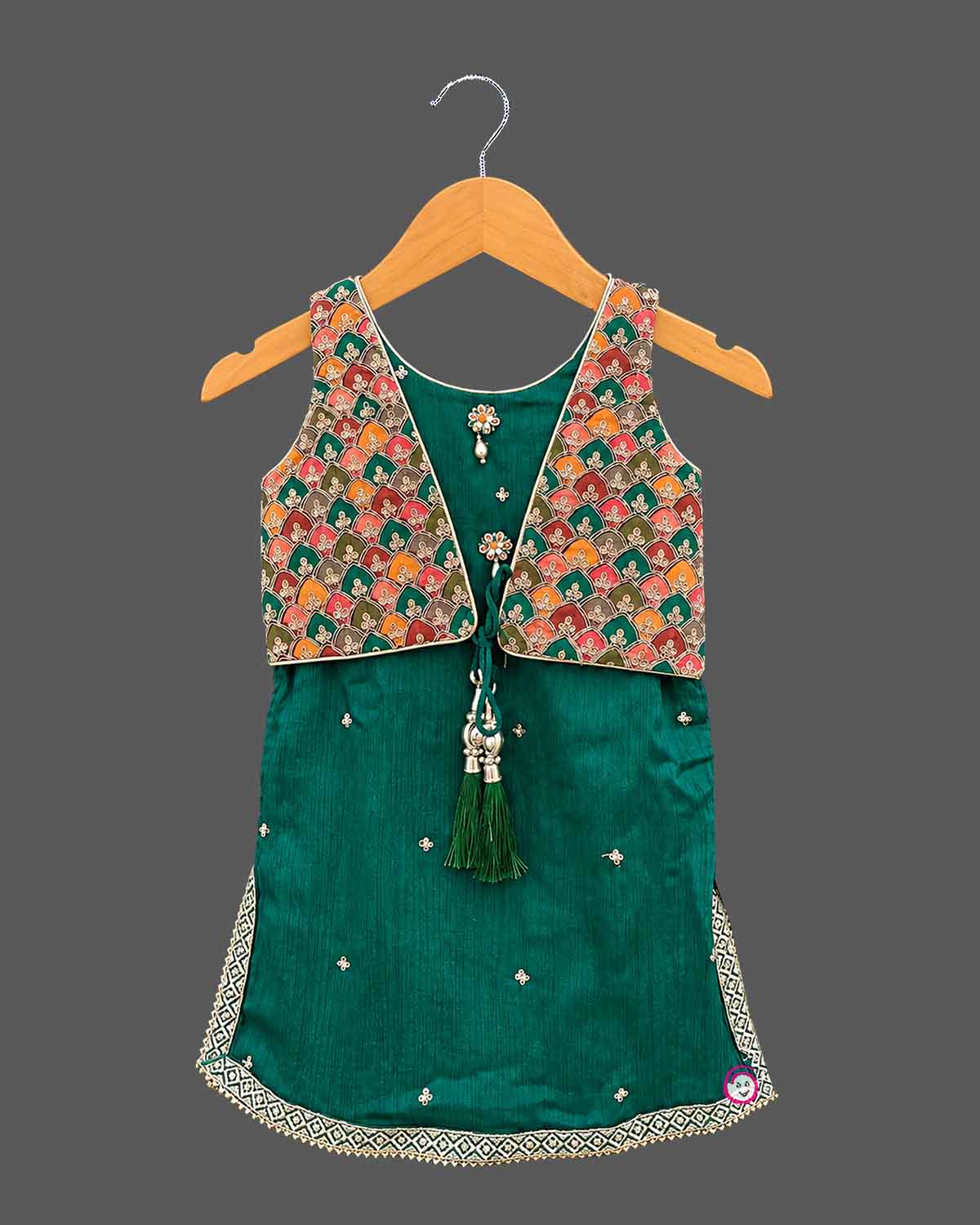 Sleeveless short kurti with attached embroidered jacket and pleated dhoti patiyala pants for kids[cite: 5].