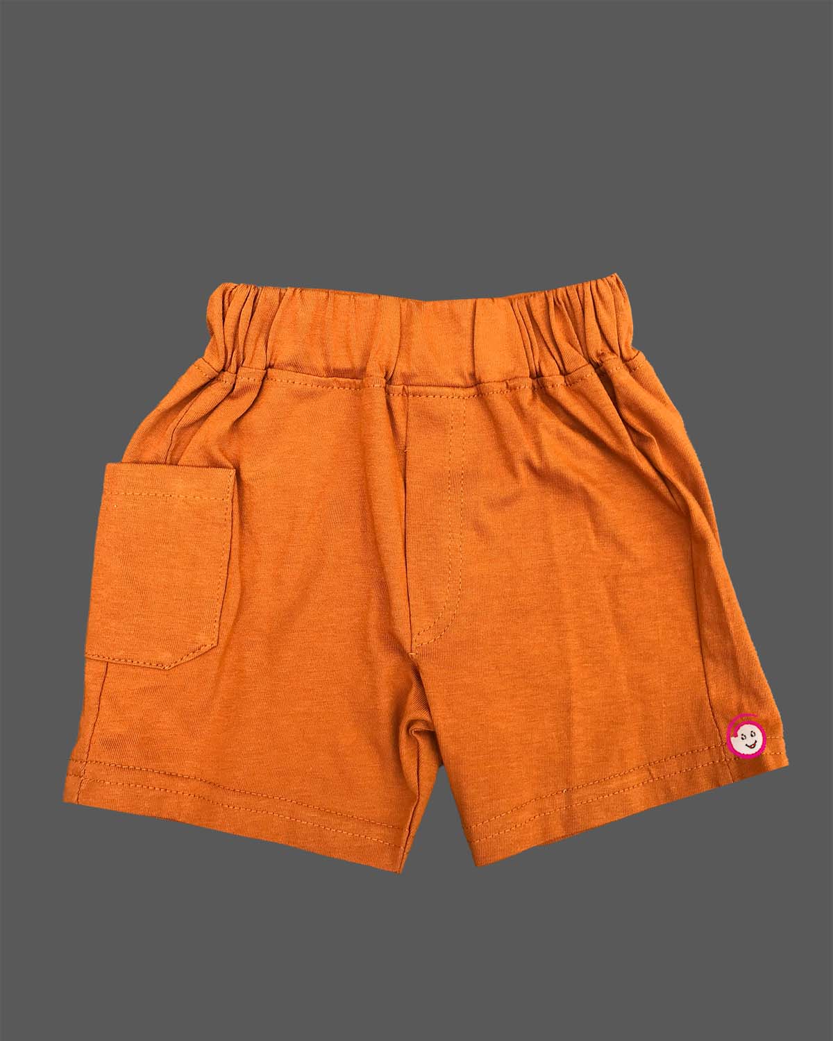 Light yellow graphic t-shirt with New York cityscape print and rust orange elasticated shorts baby boy top and shorts set for summer vacations, playdates, and park outings