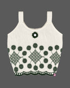 Girls sleeveless embroidered top with scalloped hem paired with pleated cuffed shorts and decorative charm.