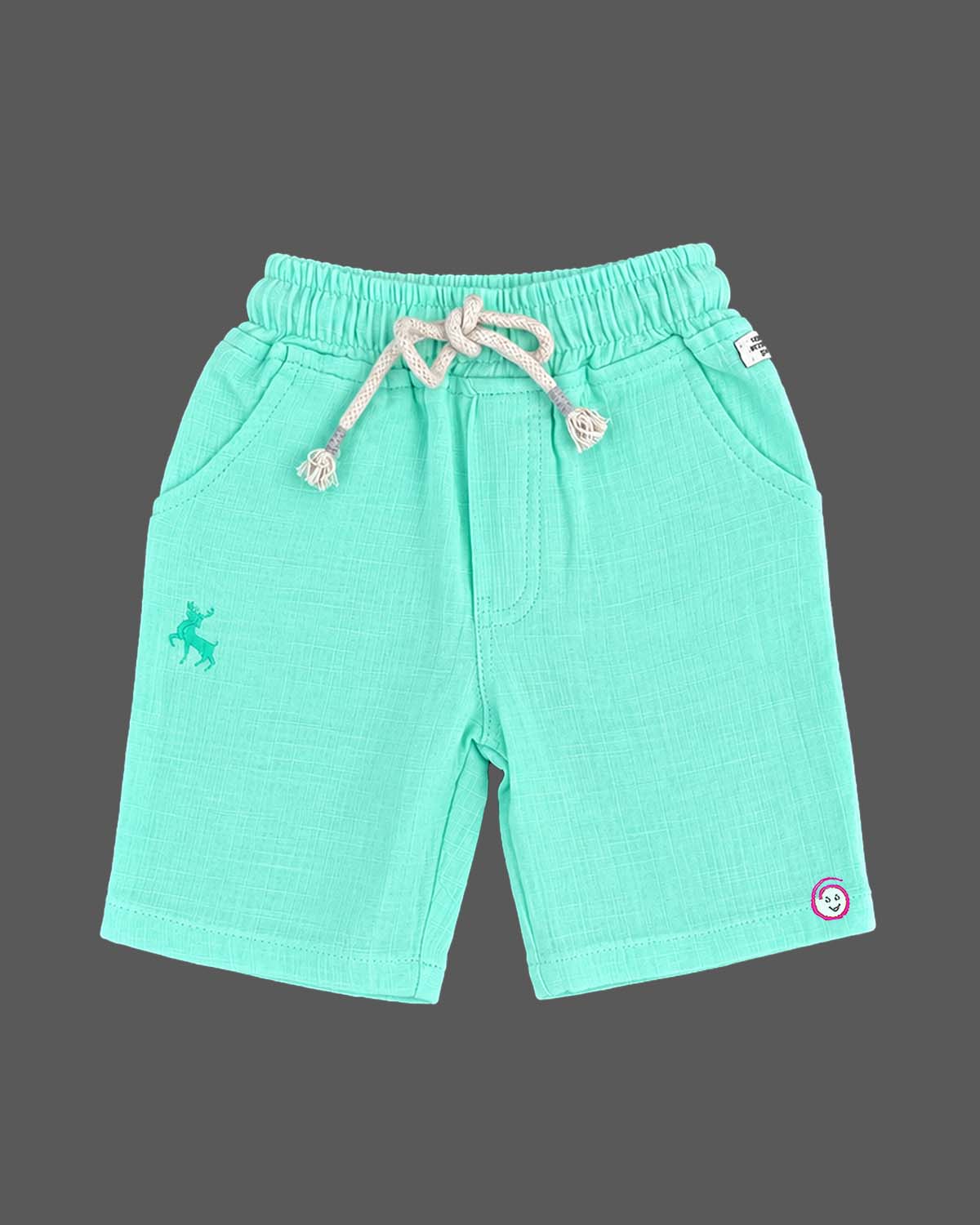 Toddler wearing kids western wear consisting of a textured collar top and drawstring shorts.