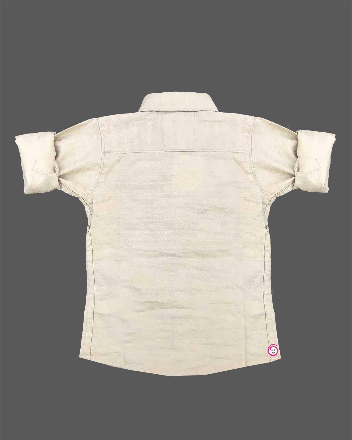 Sophisticated toddler boys button-up shirt featuring subtle micro-patterns with a small chest patch and roll-up sleeves.