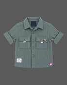 Boy wearing ribbed short sleeve button down shirt and matching cargo trousers party wear for boys