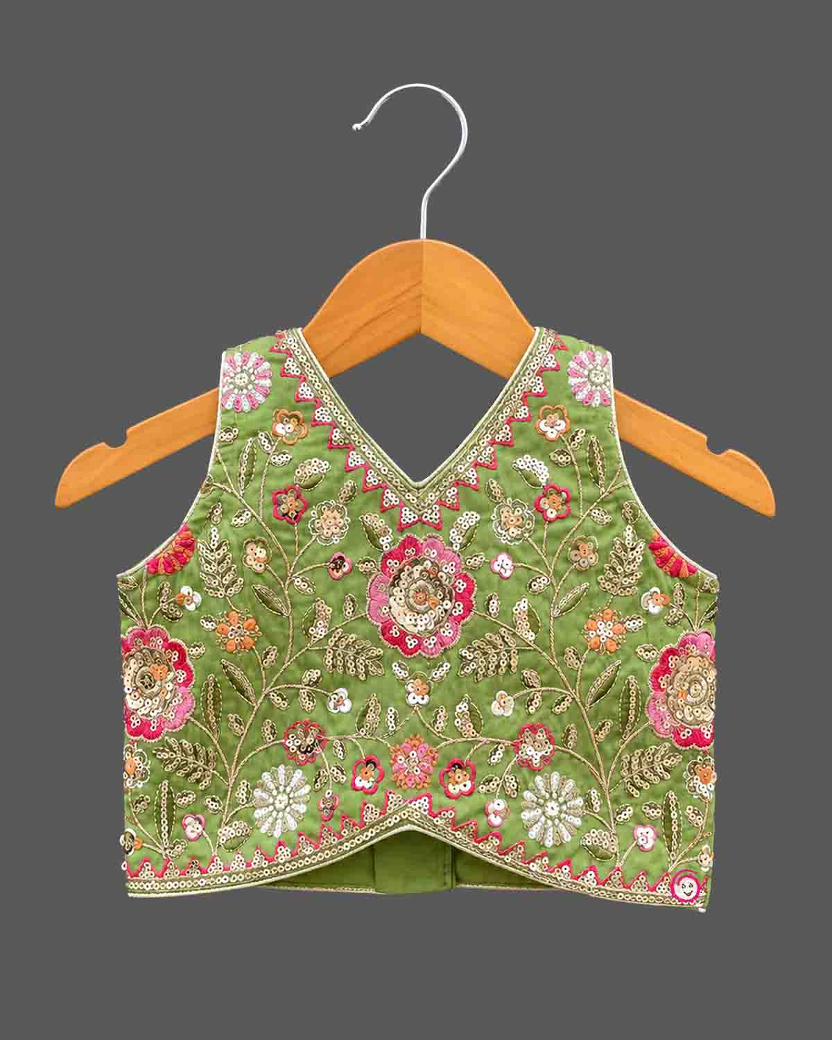 Sleeveless floral embroidered top with curved V-hem and matching pleated choli for kids skirt with sequin work.