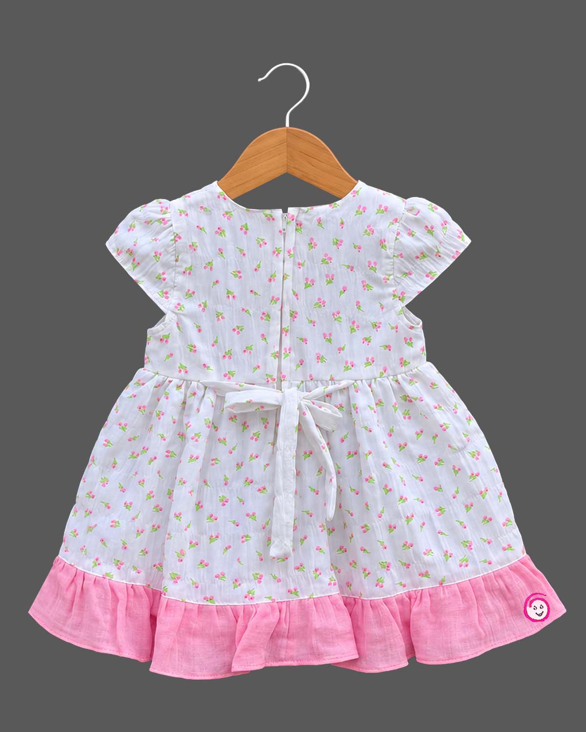 Toddler floral-print casual frock featuring a smiling sun applique and cap sleeves