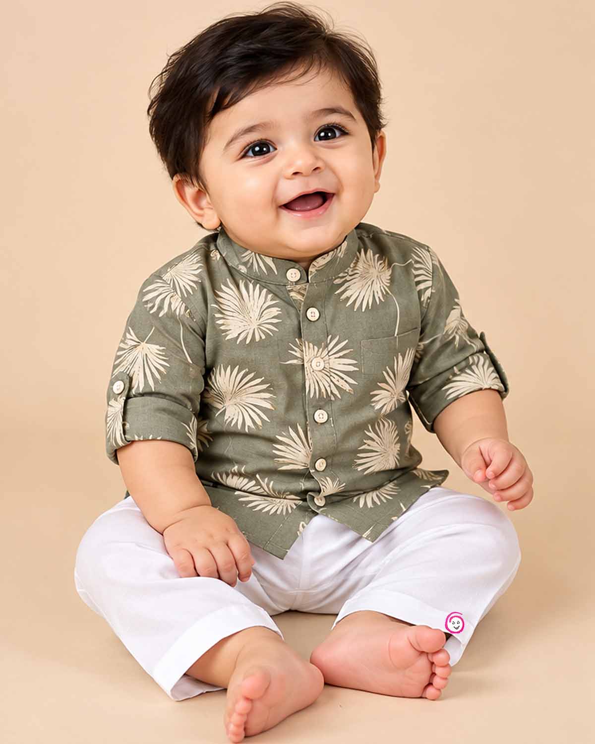 Baby boy ethnic kurta pant set featuring botanical leaf prints, mandarin collar, and roll-up sleeves.
