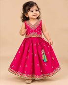 Embroidered V-neck lehenga choli for kids set featuring intricate threadwork, pleated skirt, and sheer dupatta