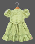 Pistachio green textured cotton girls frock with puff sleeve and tassels