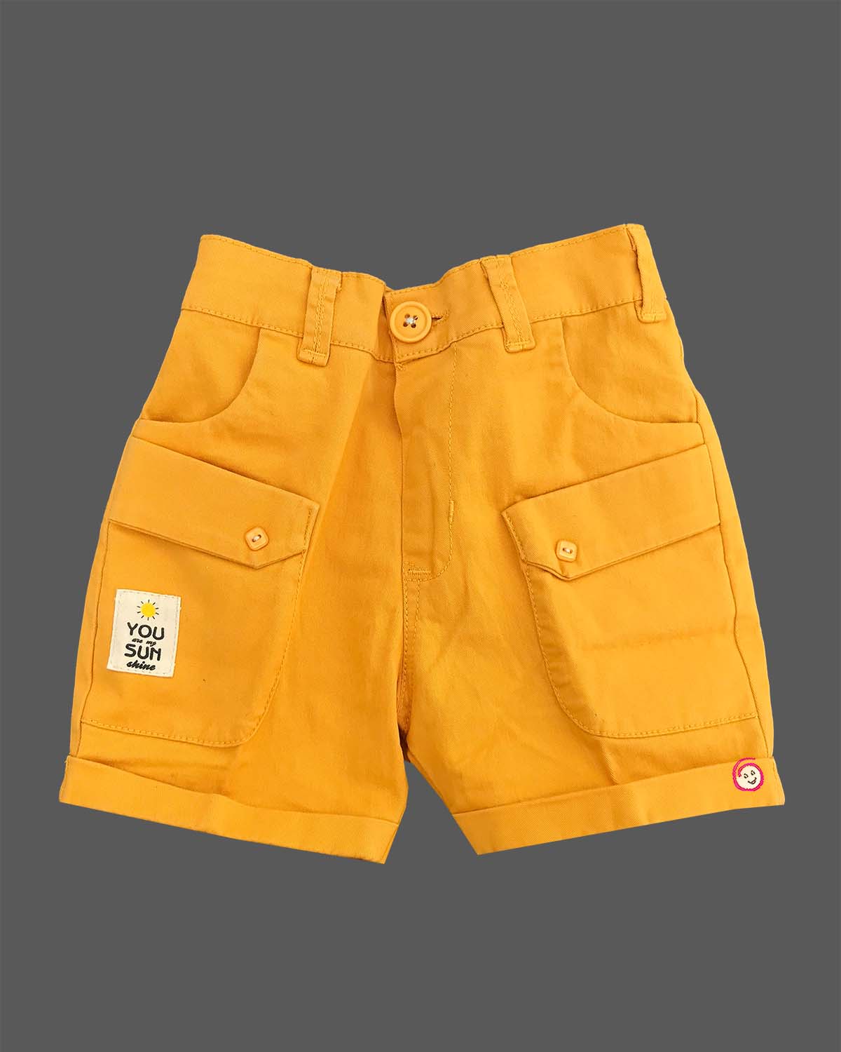 Boys attire featuring a tropical pattern button-down shirt, cargo style shorts, matching neck bow, and adjustable floral motif suspenders.