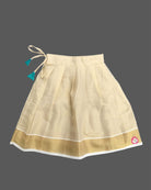 Little darling two-piece traditional festive ethnic outfit with floral chest brooch and pleated zari bordered skirt.