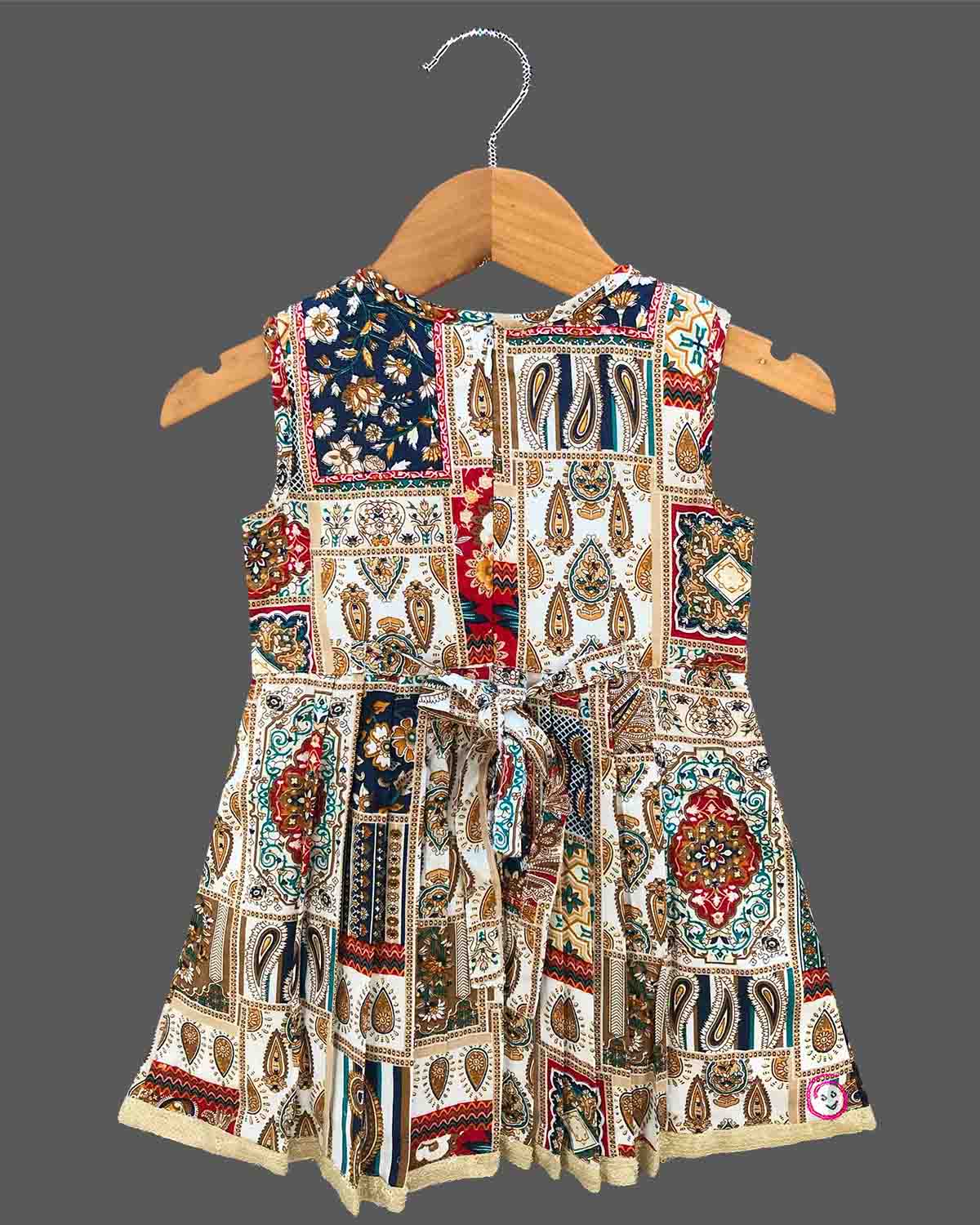 Toddler printed cotton frock with smocked neck and front lace tie ups for casual outing and birthday celebration