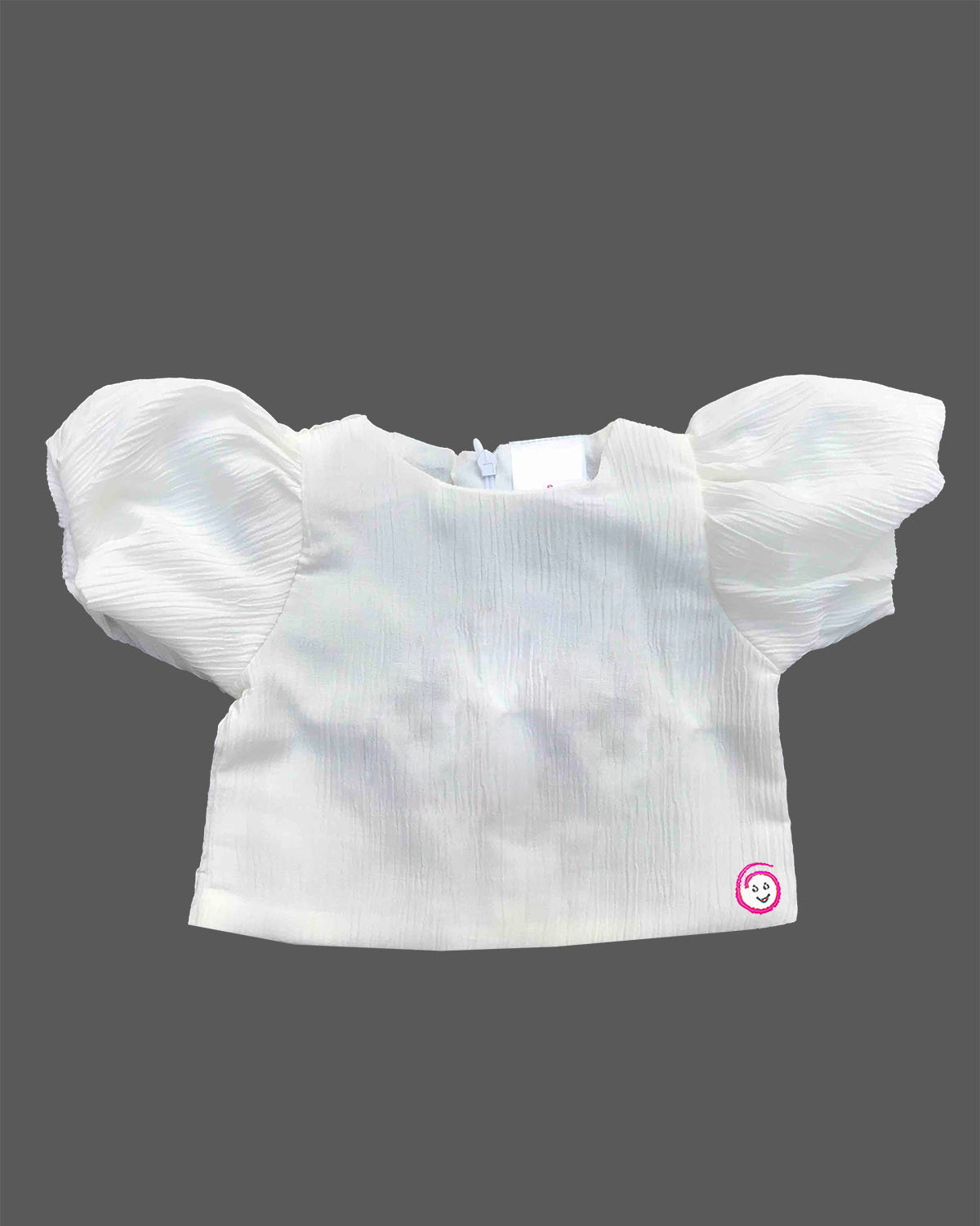 Toddler girl outfit set featuring textured puff sleeve blouse and denim pinafore dress with bunny patch detail and pleated skirt