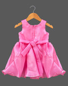 Silk frocks for baby girl featuring rosette bodice and pleated fit-and-flare satin skirt