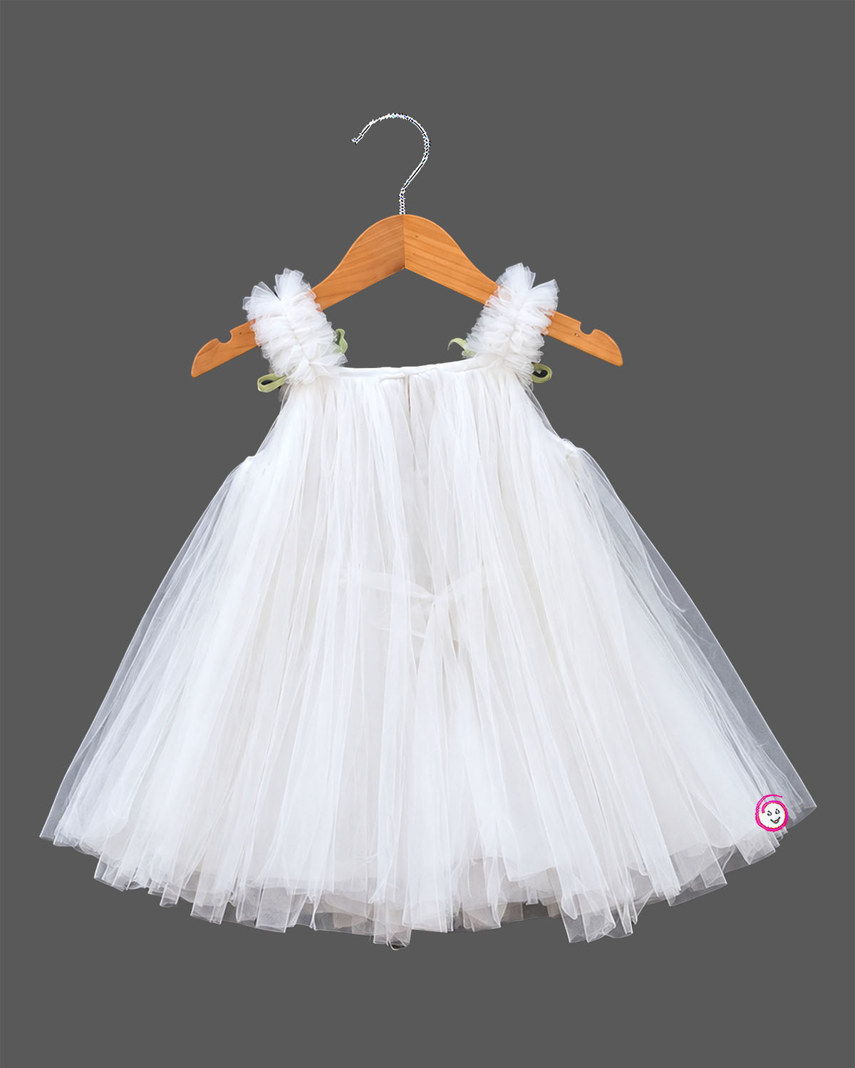 Off white net party frock with pink tulip floral accents and strap bows for girls