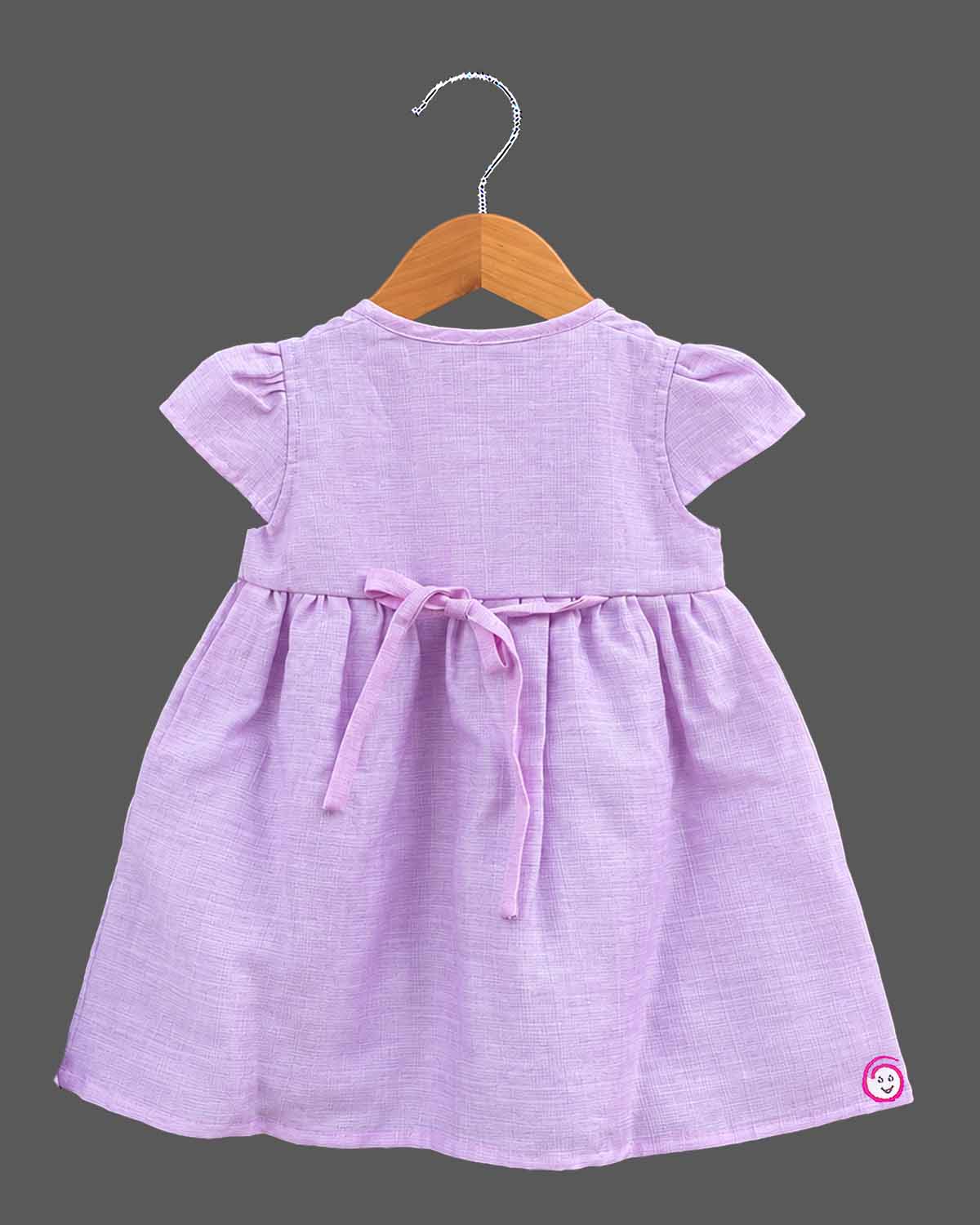 Infant gathered button frock with floral hem embroidery and baby casual wear dress styling
