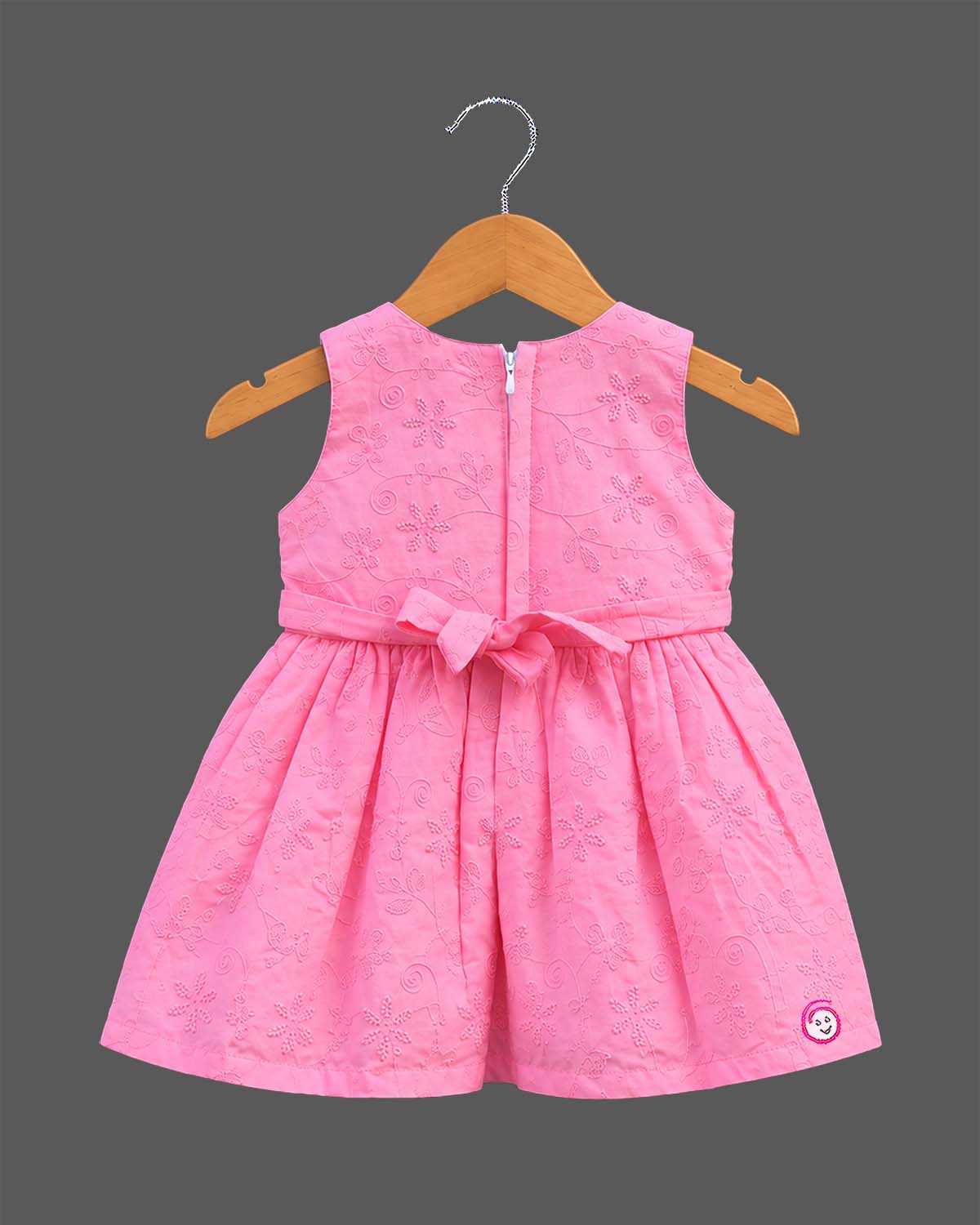 Sleeveless embroidered schiffli floral A-line frock with waist belt and flower applique for toddler girls.