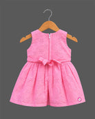 Sleeveless embroidered schiffli floral A-line frock with waist belt and flower applique for toddler girls.