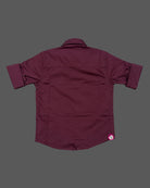 Boys party wear embroidered button-down shirt with spread collar and roll-up sleeves.