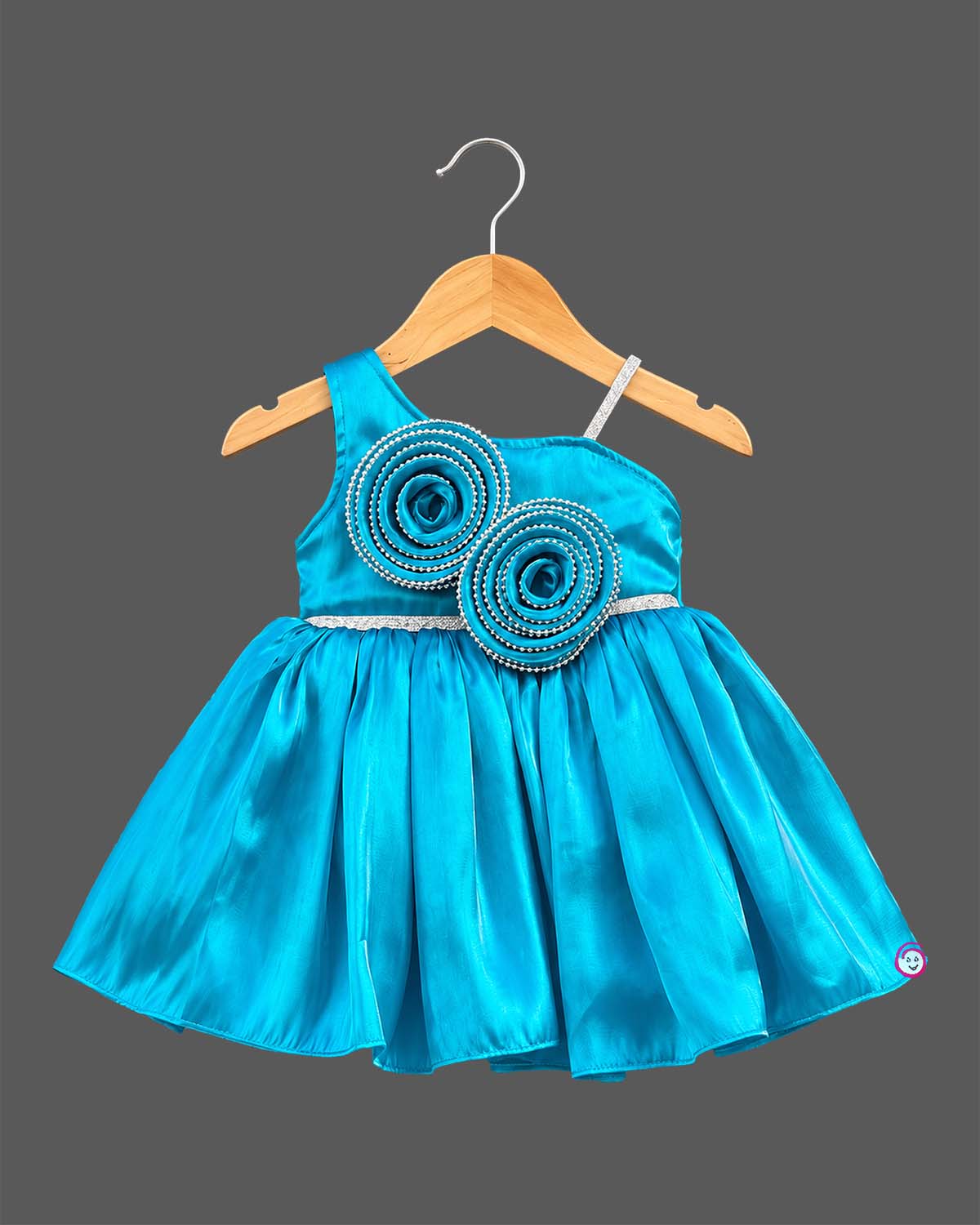 Silk frocks for baby girl with asymmetrical one-shoulder cut and beaded floral applique.