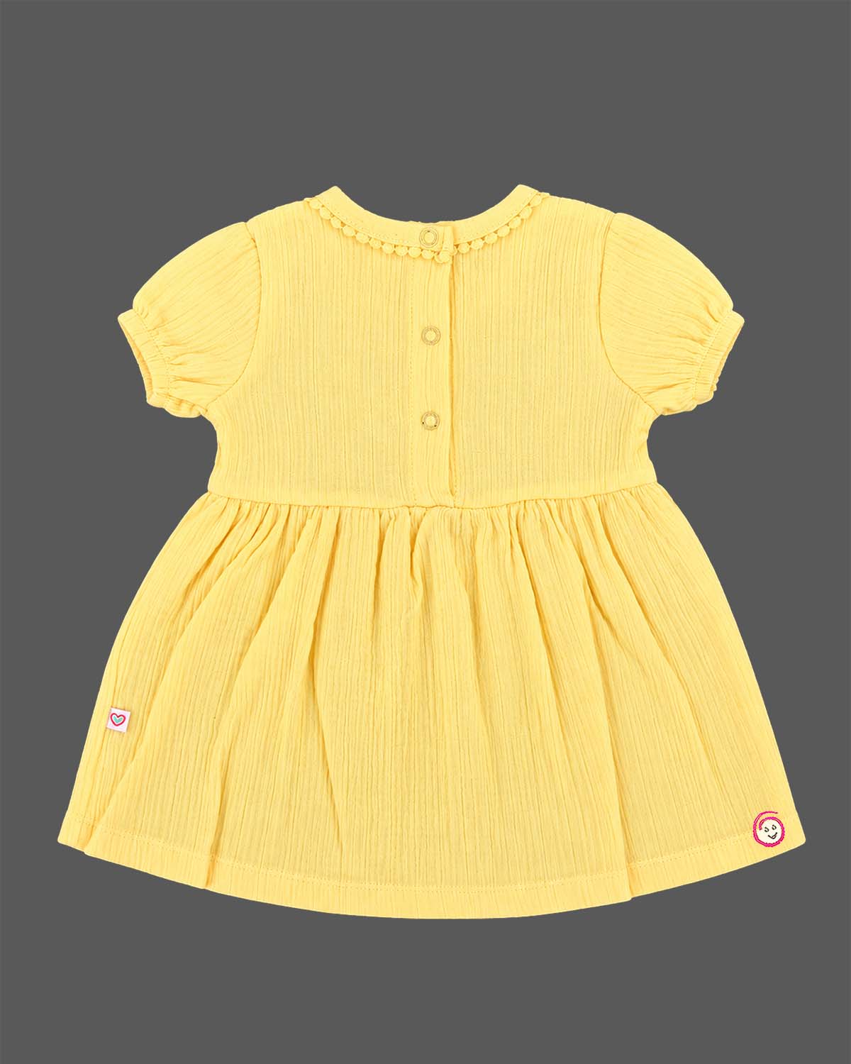 Infants frock in soft textured cotton fabric for casual playdates and baby clothes collection.
