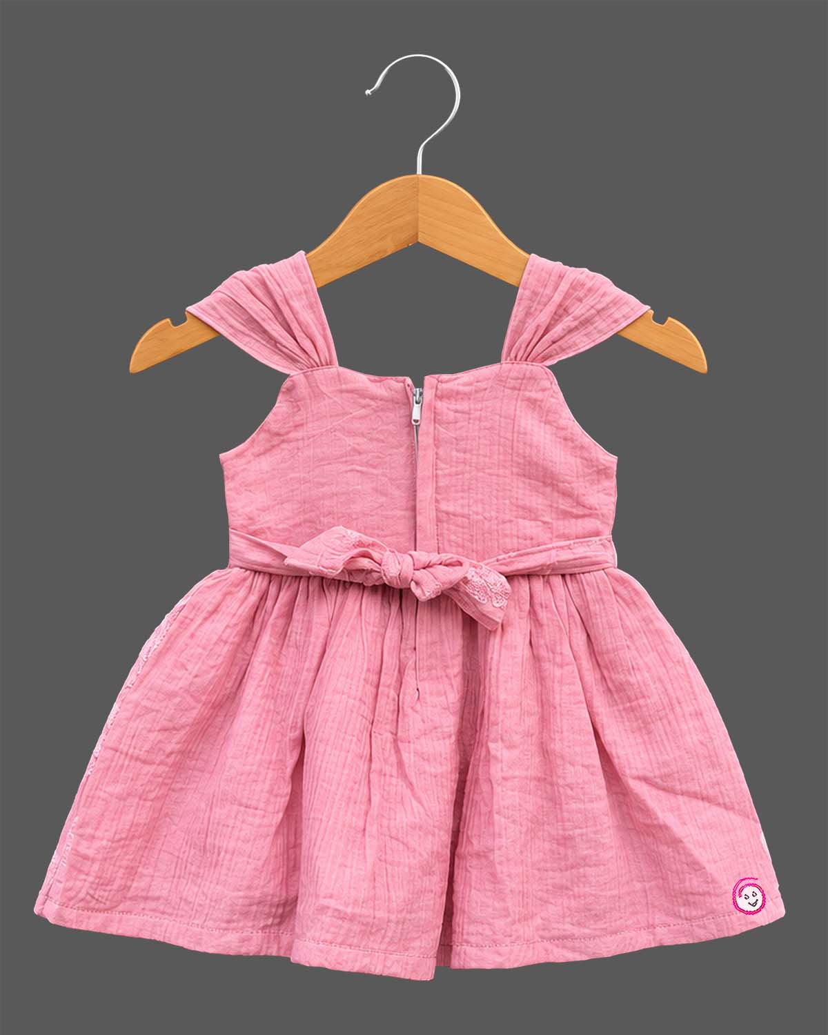 Toddler floral embroidered muslin frock with pleated cap shoulder straps and gathered A-line flared skirt.