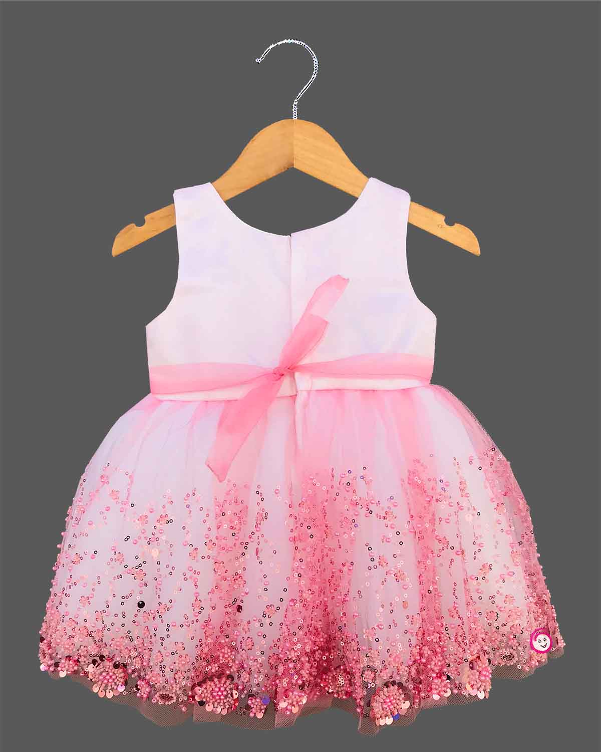 Baby pink sequin floral embroidered net party frock with waist bow for baby girls grand celebrations, temple visits, and family festivals