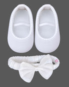 Flared netting baby party wear dress with oversized bodice rosette, matching bow headband, and soft booties.