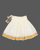Little fashionista traditional two-piece festive choli set with woven zari borders and pleated ethnic skirt.