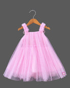 Little princess pink net frock with shimmer tulle overlay and floral shoulder embellishments for party wear