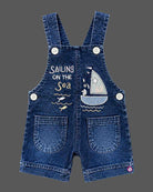 dungaree set for boys featuring sailboat embroidery and matching printed tee