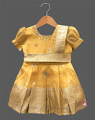 Toddler yellow cotton silk frock with border for festive wear