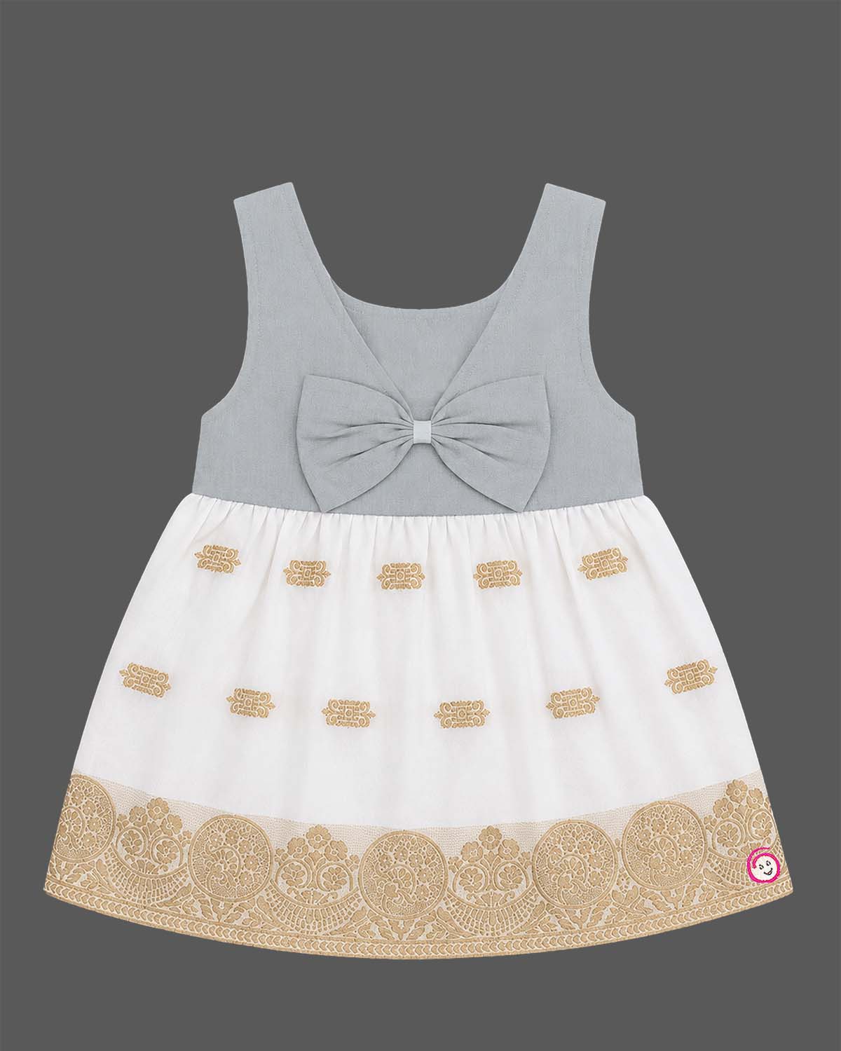 Sleeveless traditional festive attire for toddlers styled with metallic border motifs and chest embroidery.