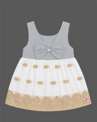 Sleeveless traditional festive attire for toddlers styled with metallic border motifs and chest embroidery.