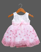 Sleeveless net fit-and-flare girl frock with floral waist appliqué and sequin detailing for parties.