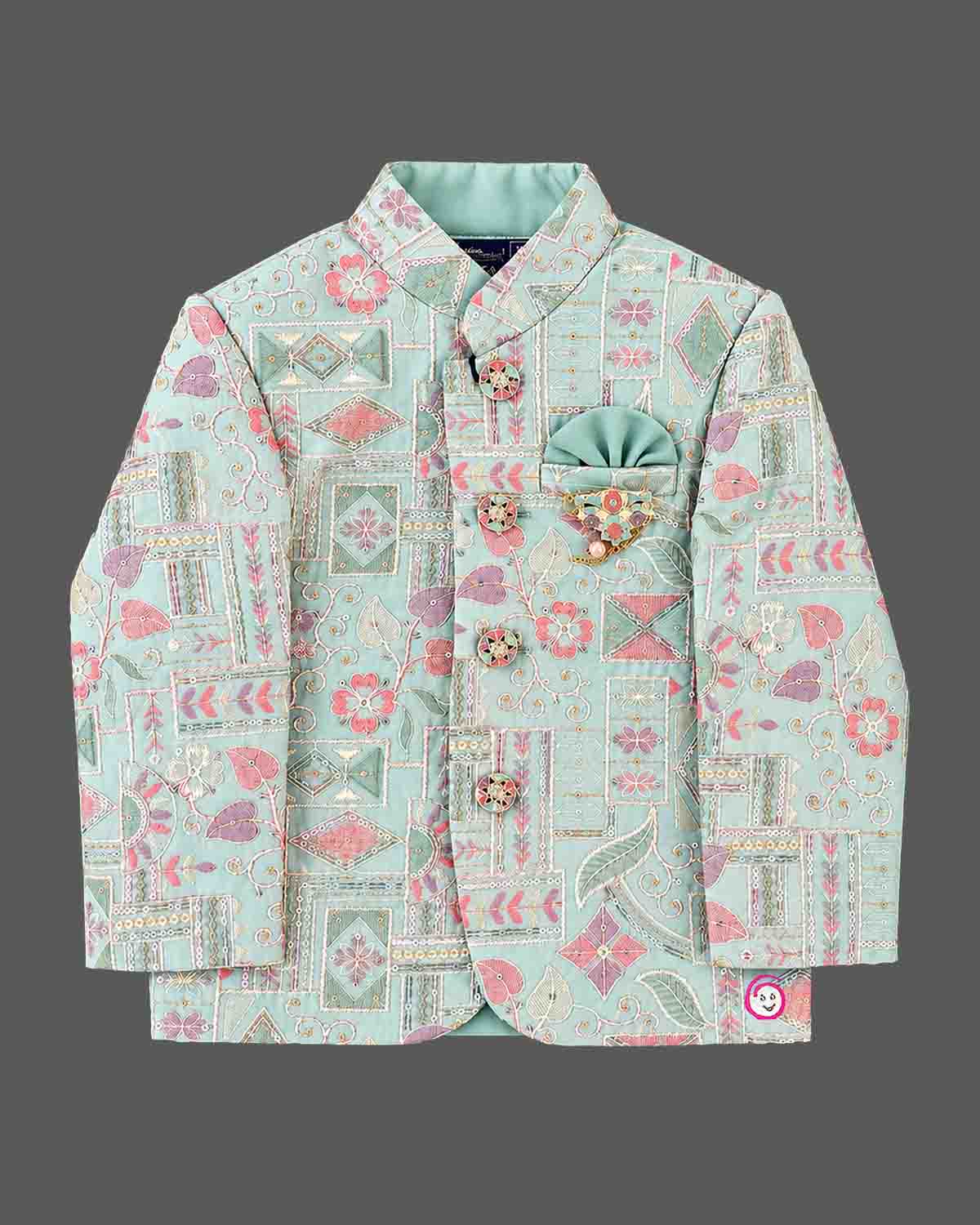 Detailed kids sherwani featuring geometric jacquard weave with mandarin collar and pocket square accent.