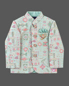 Detailed kids sherwani featuring geometric jacquard weave with mandarin collar and pocket square accent.