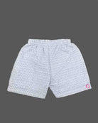 A matching casual shirt and shorts duo for young boys featuring an all-over patterned design and a comfortable elastic waistband.