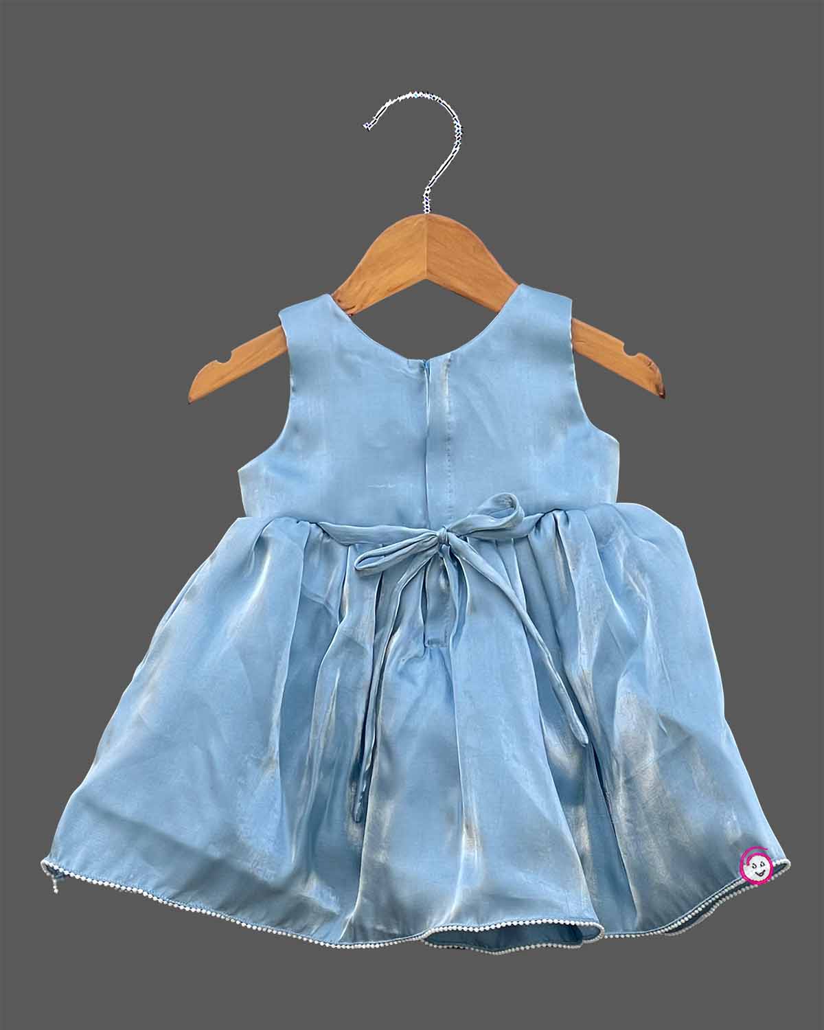 Powder blue satin frock for girls featuring floral beaded waist embellishments and pearl trim hem