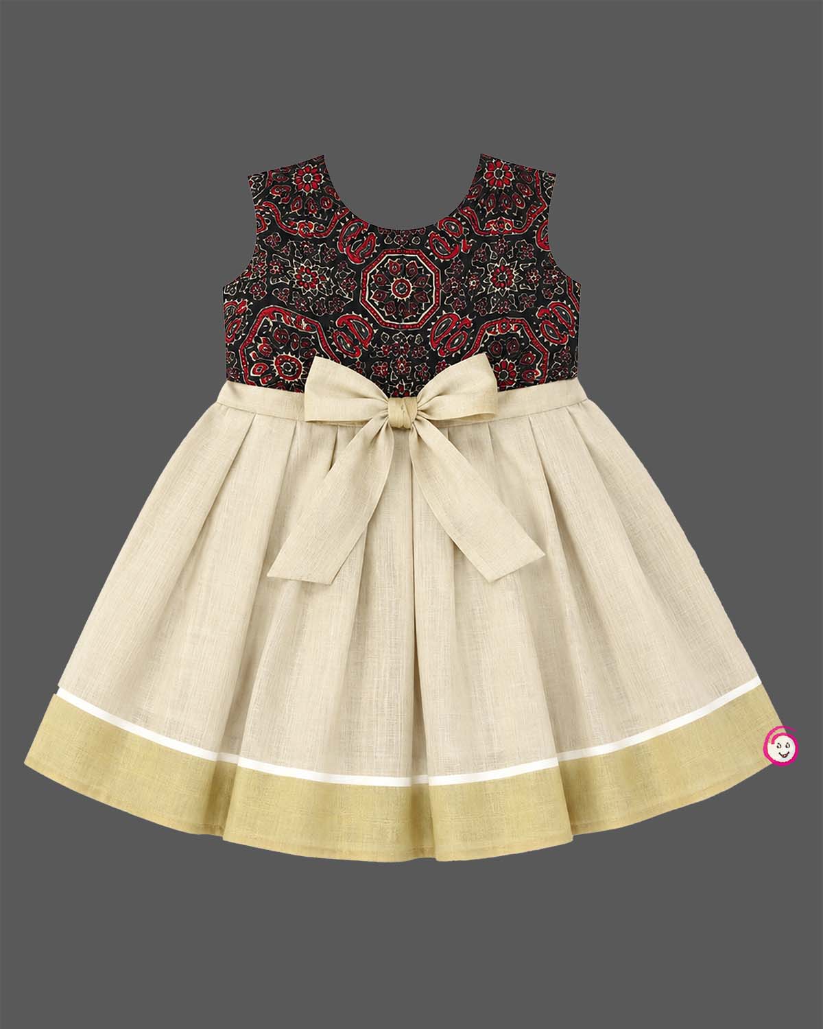 Little one wearing Ajrakh print peter pan collar frock with waist rosette detail and Kasavu border