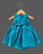 Teal blue satin party frock for toddler girls with large floral accents on shoulder and waist