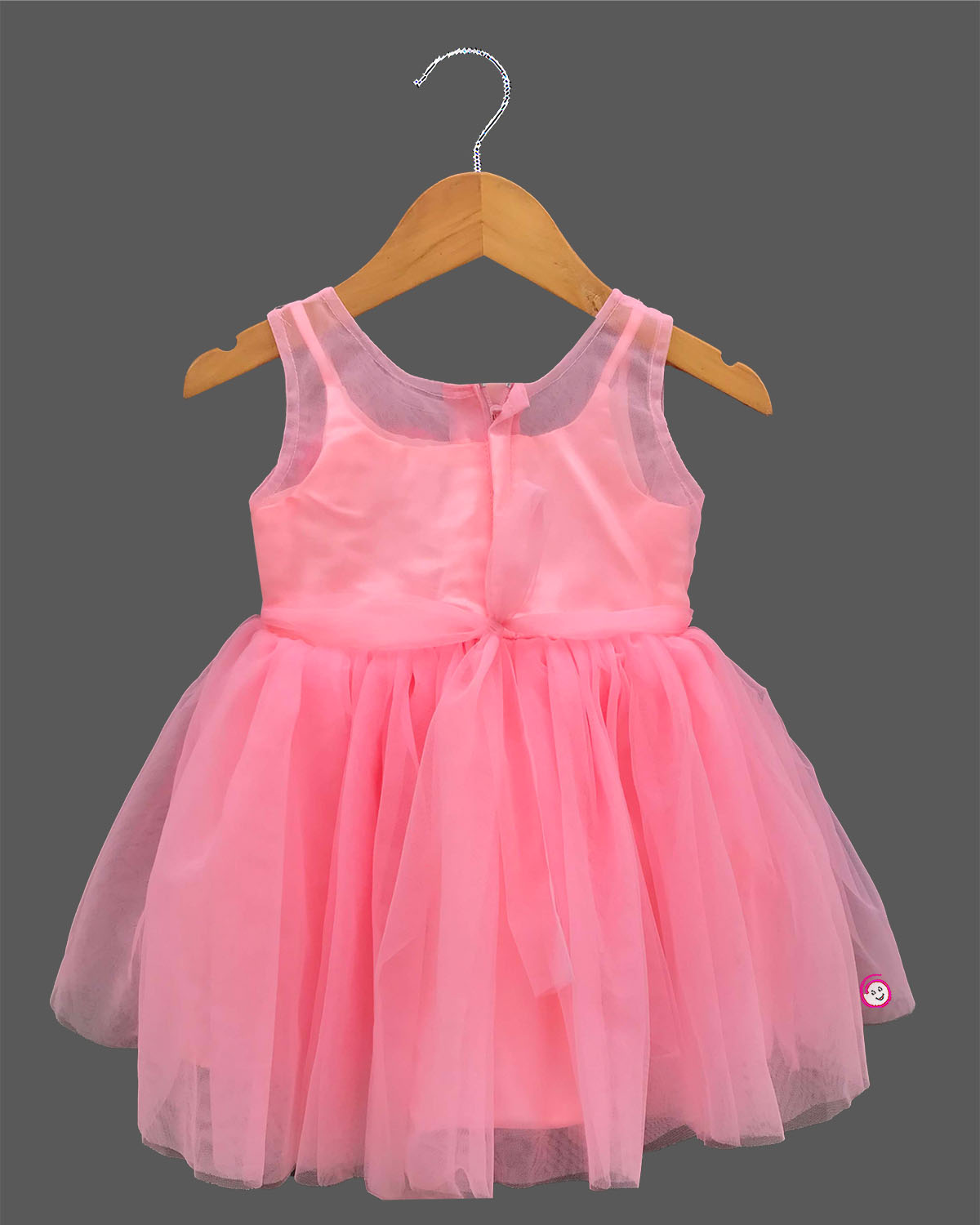 Sleeveless fairy-tale celebration attire for toddlers featuring layered net flare and handcrafted floral bodice appliques.