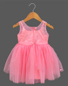 Sleeveless fairy-tale celebration attire for toddlers featuring layered net flare and handcrafted floral bodice appliques.
