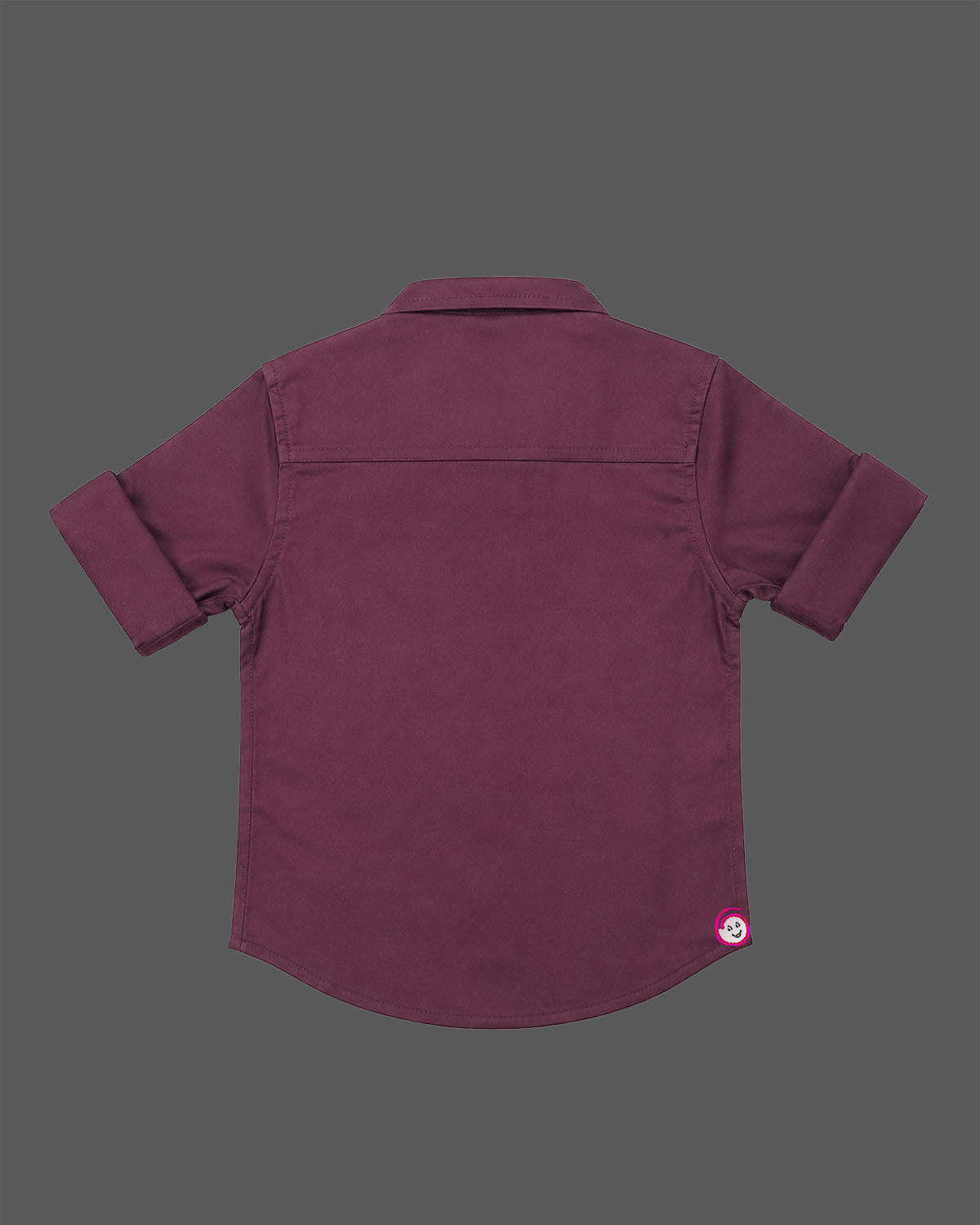 Detailed view of a boys collared party shirt embellished with elegant vertical stud patterns and roll-up sleeves.