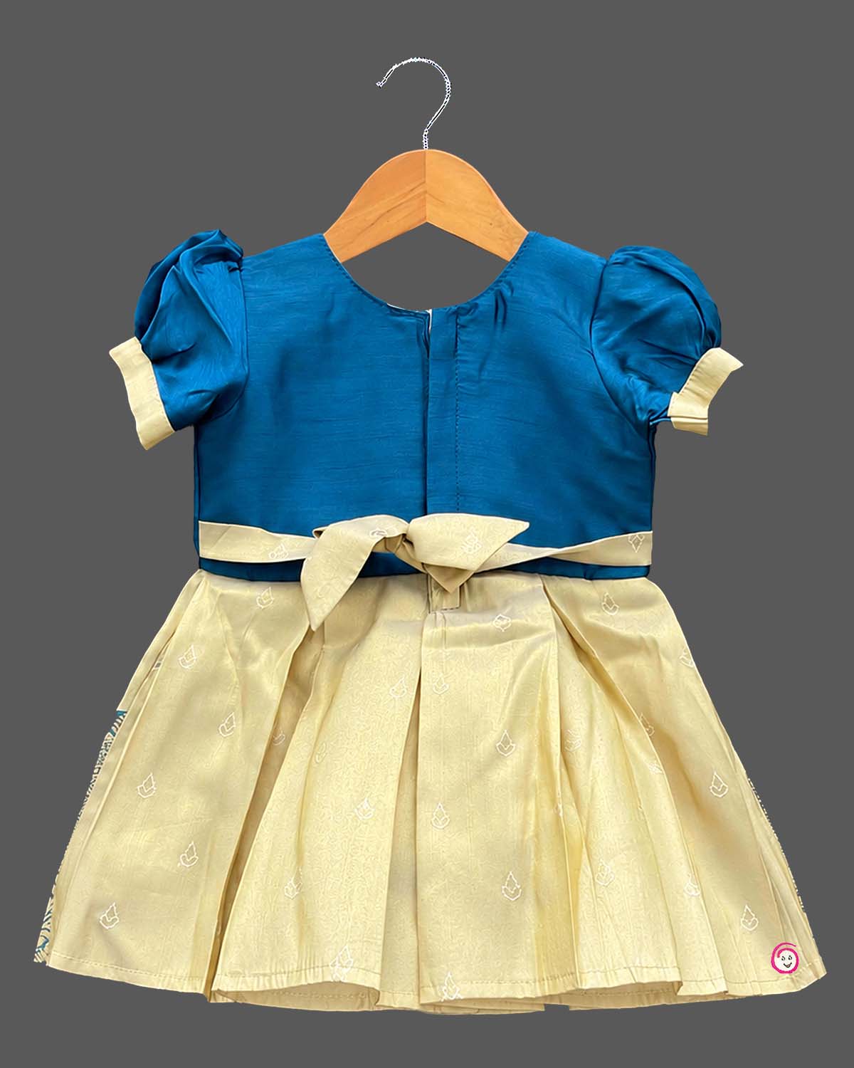 Toddler kids silk cotton frock ethic wear featuring embroidered round neck, puffed sleeves, and bordered skirt.