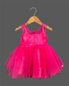 Sleeveless party outfit for toddlers with layered tulle skirt and handcrafted rosette chest appliques.
