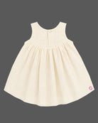 Traditional traditional baby frock for festivals with golden border details and bow accent