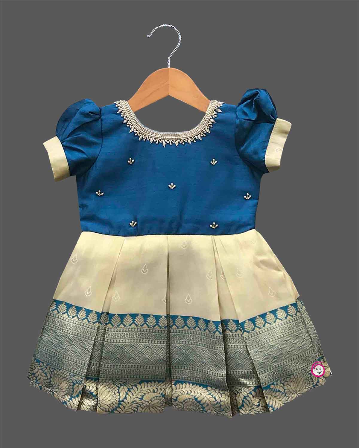 Baby girl silk blend traditional frock featuring zari border and puff sleeves for cultural events